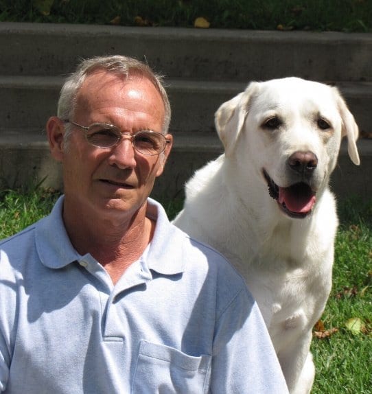 man and dog smiling together