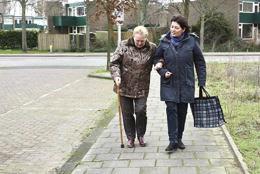 Two women walking outside together in winter