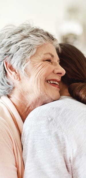two women hugging hospice care