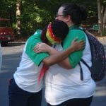 Campers embrace during an activity