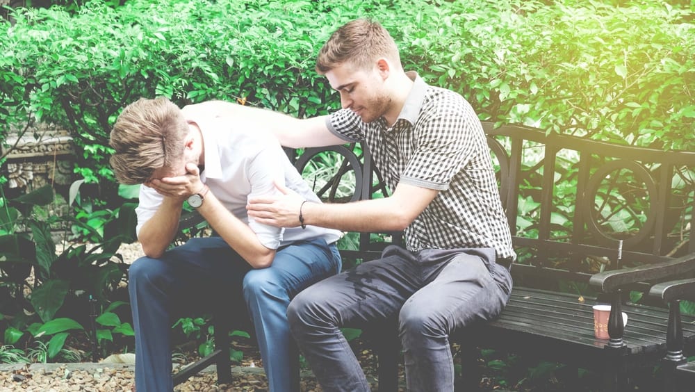 myths of grief_man comforting another