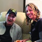 Charles Angus with a social worker